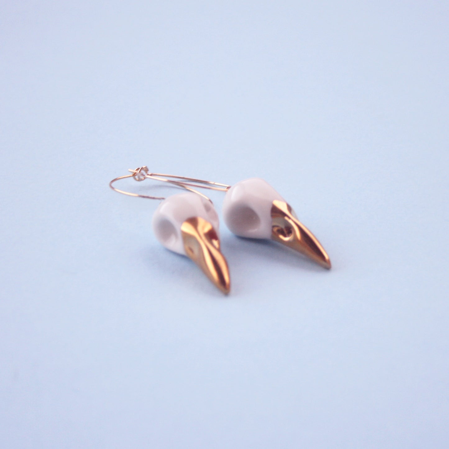 Gold-plated porcelain crow skulls hoop earrings