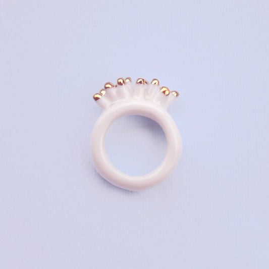White porcelain ring with golden spikes, handmade by Siamese Twin Studio