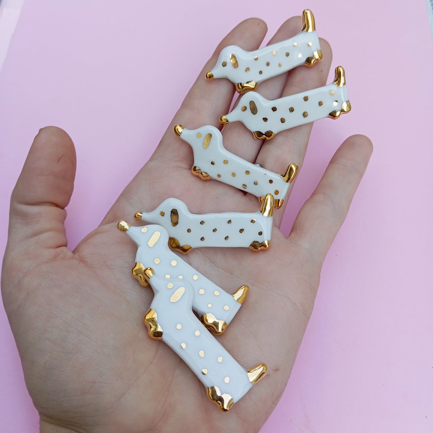 Weenie Dog Brooches Golden flat lay – luxury handmade ceramic dachshund pinS by Siamese Twin Studio