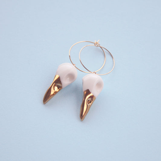 Gold-plated bird skulls porcelain hoop earrings 