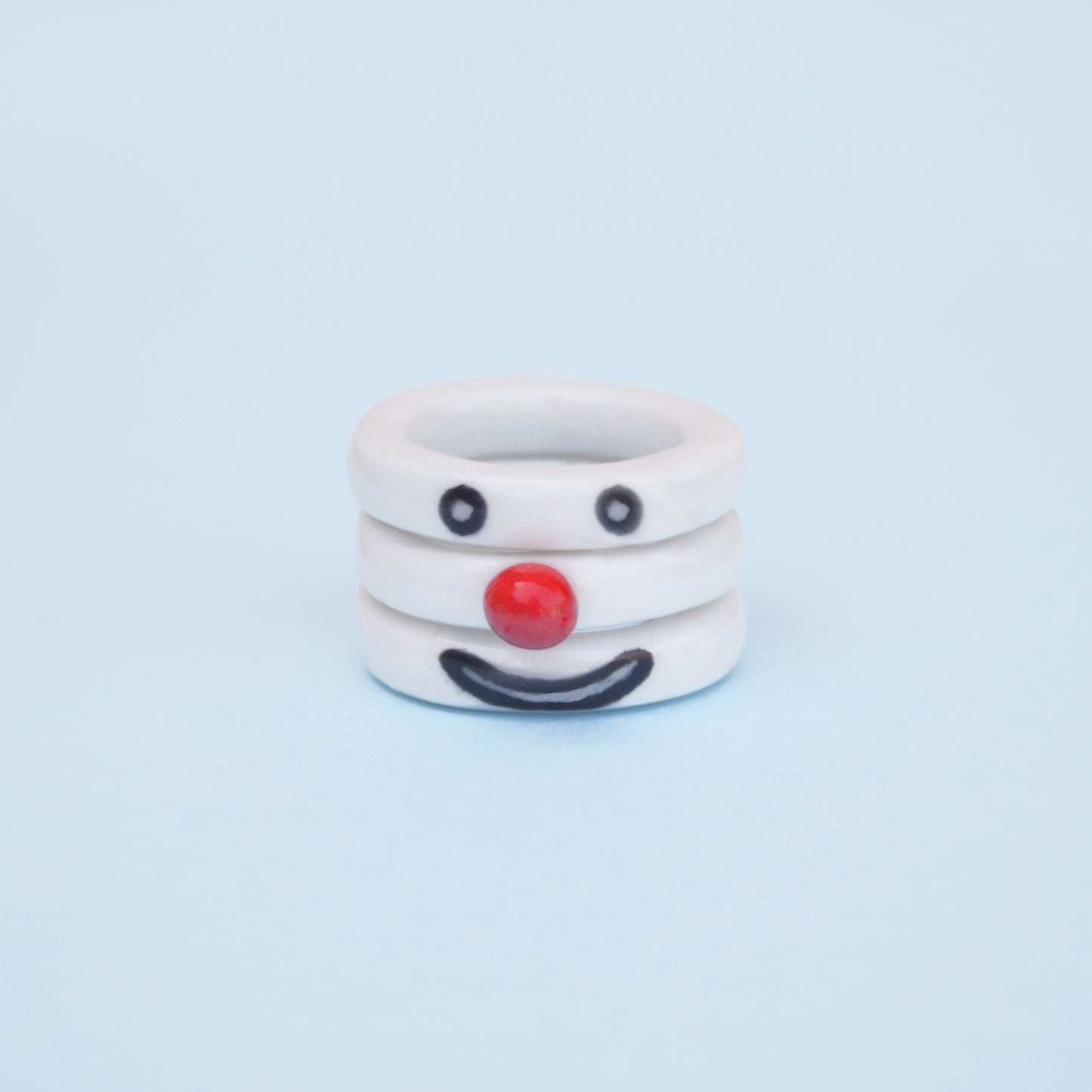 Porcelain stacking clown ring reversible playful