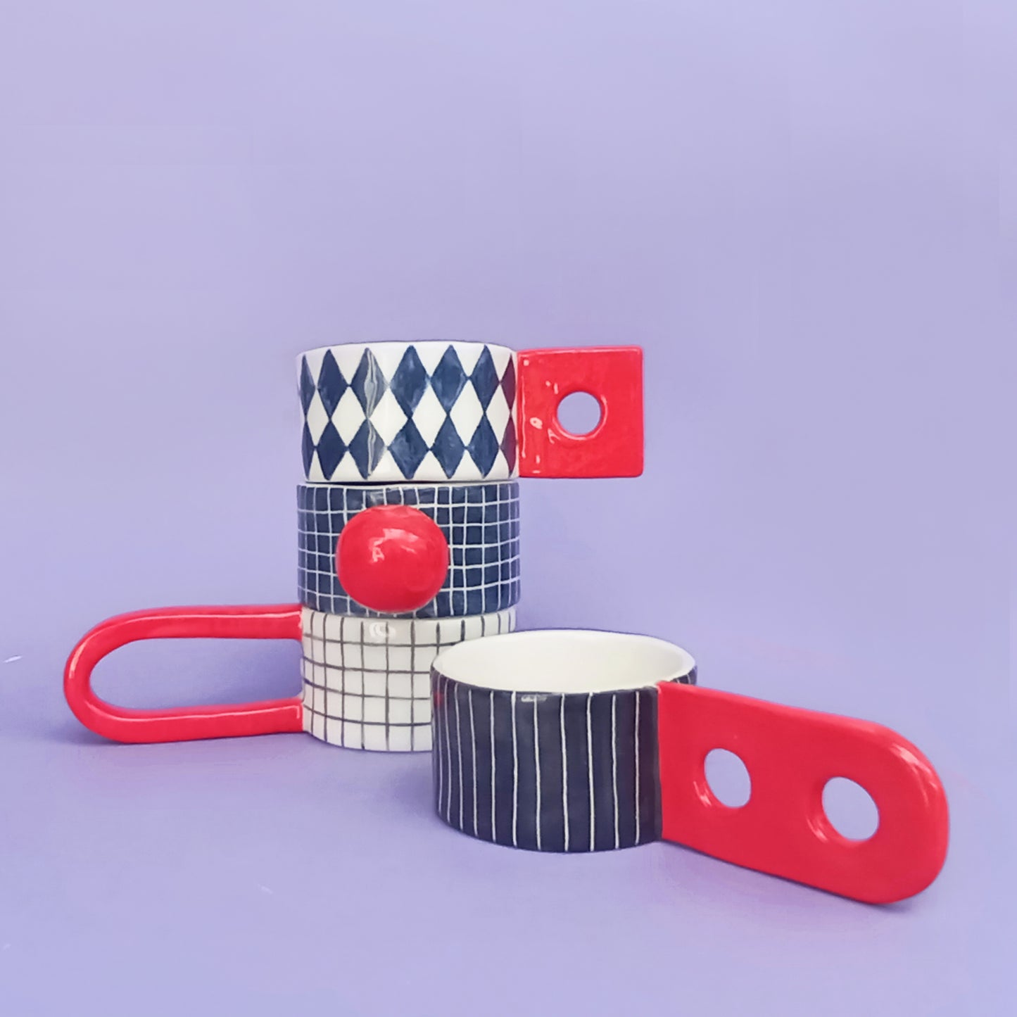 Graphic Cups set showing diamond and stripe patterns – handmade earthenware cups with unique sculptural handles, 120ml, designed by Siamese Twin Studio
