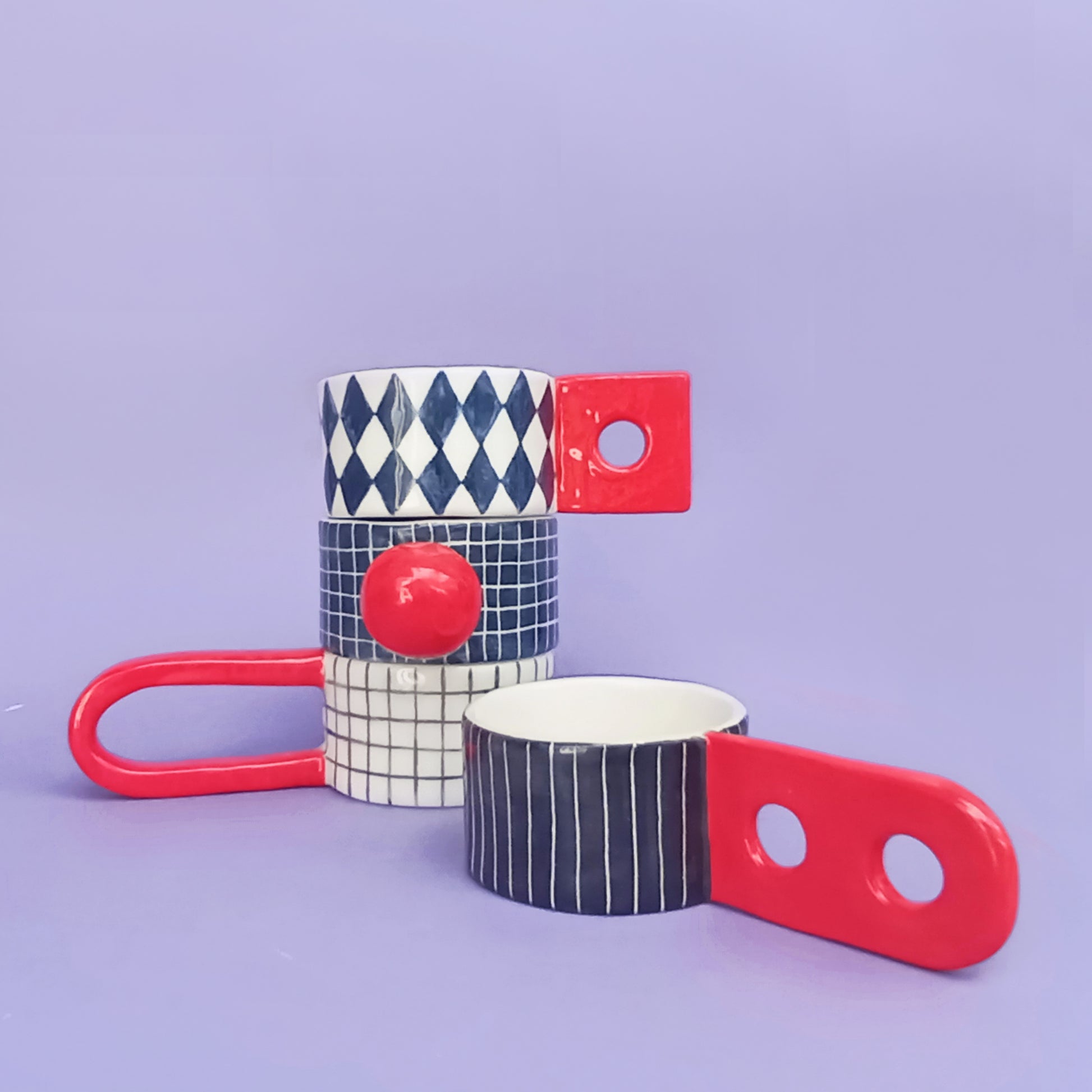 Graphic Cups set showing diamond and stripe patterns – handmade earthenware cups with unique sculptural handles, 120ml, designed by Siamese Twin Studio
